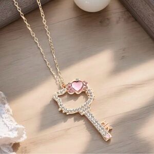 Elegant HELLO KITTY Gold Key Pendant Necklace with Pink Accents